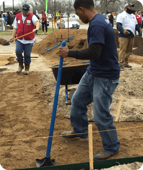 Houston Toolbank volunteers spreading dirt