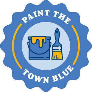 A blue badge featuring a paint bucket and brush saying, "Paint The Town Blue"