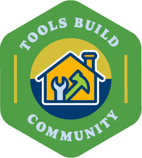 A green icon that says, "Tools Build Community" and features a house with tools inside of it